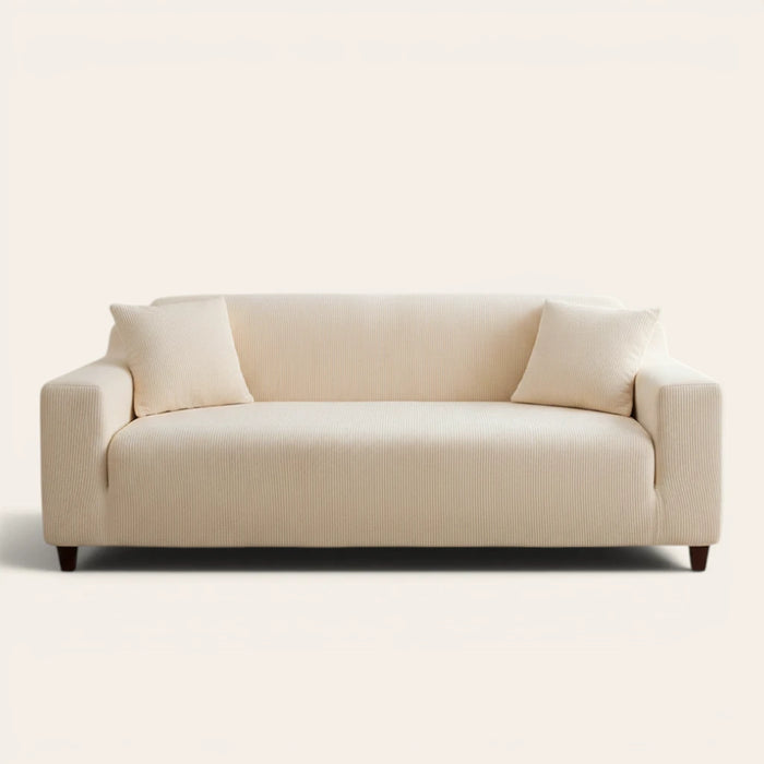 Cream corduroy stretch sofa cover fitted on a two-seat sofa, front view on ivory backdrop