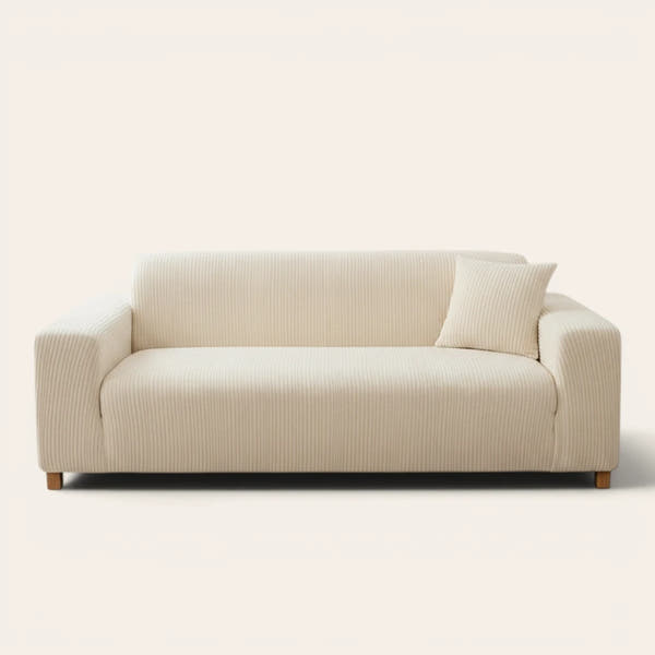 Cream whisper corduroy sofa cover fitted on a three seater sofa, front view on ivory