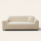 Cream whisper corduroy sofa cover fitted on a three seater sofa, front view on ivory