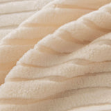 Macro of plush cream whisper corduroy fabric with its soft raised ribbing