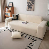 Cream whisper corduroy sofa cover styled in a sunlit room with a cushion and patterned rug
