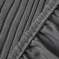 Detail of the overlocked elastic hem edge on the graphite shadow corduroy cover