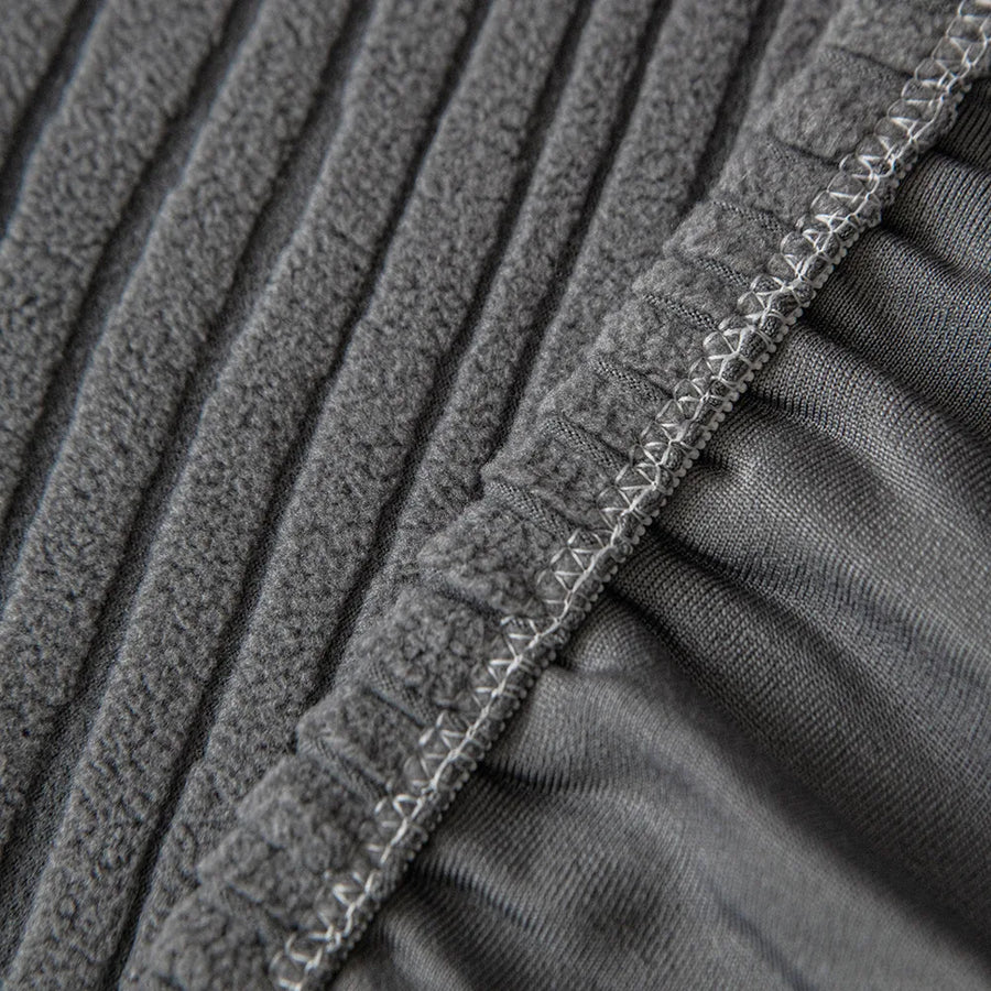 Detail of the overlocked elastic hem edge on the graphite shadow corduroy cover