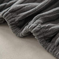 Close up of the gathered elastic edge and ribbing on graphite shadow corduroy fabric