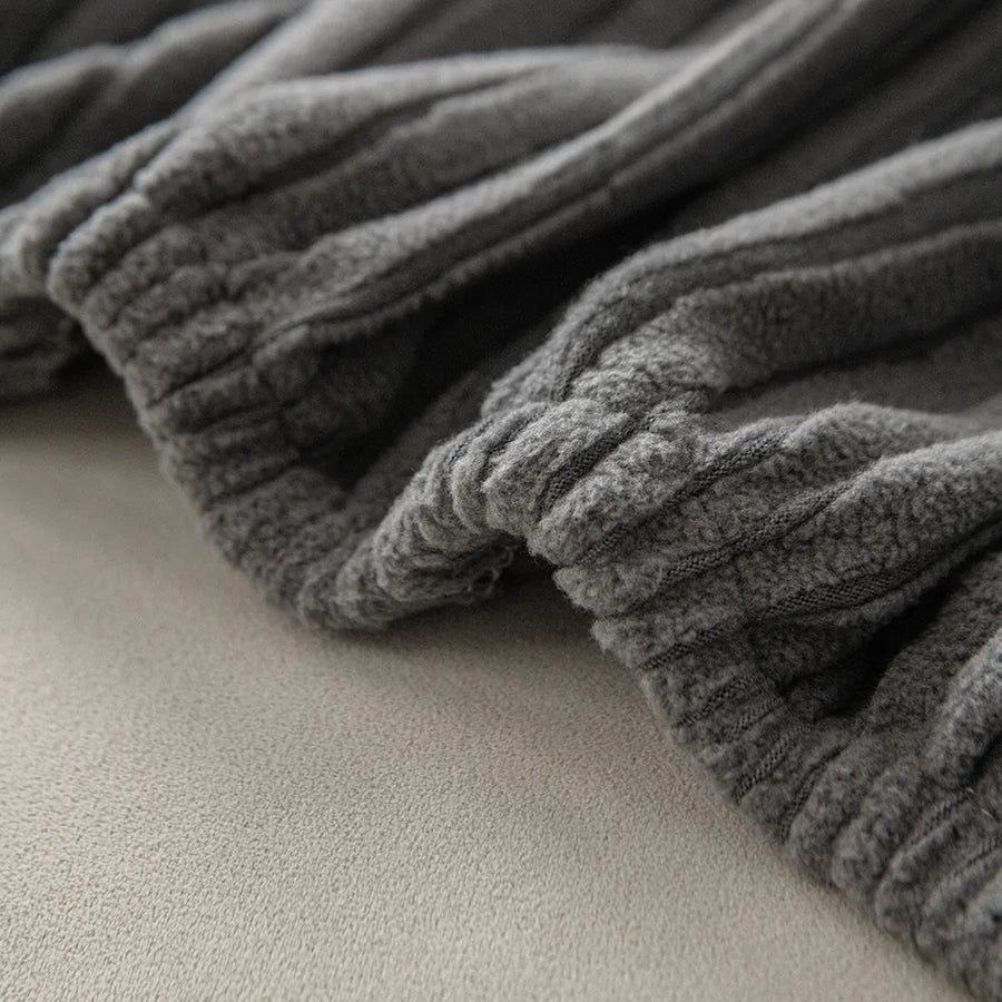 Close up of the gathered elastic edge and ribbing on graphite shadow corduroy fabric