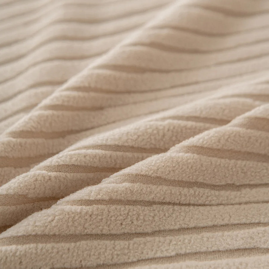Macro of chunky linen beige corduroy fabric with its raised vertical ribbing