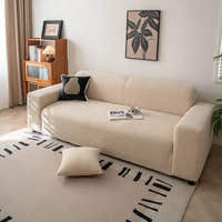 Linen beige corduroy sofa cover styled in a sunlit room with a cushion and patterned rug