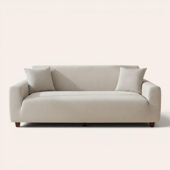 Mist gray corduroy sofa cover fitted on a three seater sofa, front view on ivory