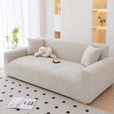 Mist gray corduroy sofa cover styled in an airy living room with cushions and rug