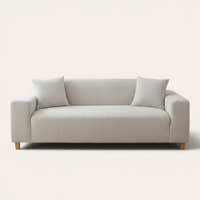 Silver Cloud corduroy sofa cover fitted on a three-seat sofa with matching cushions, front view on ivory