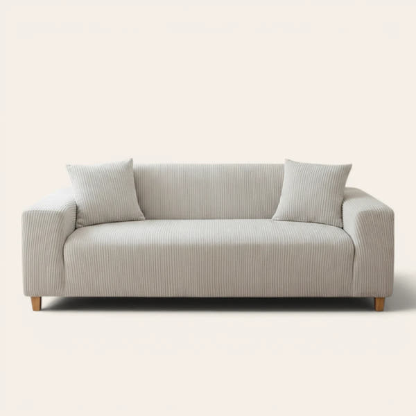 Silver Cloud corduroy sofa cover fitted on a three-seat sofa with matching cushions, front view on ivory