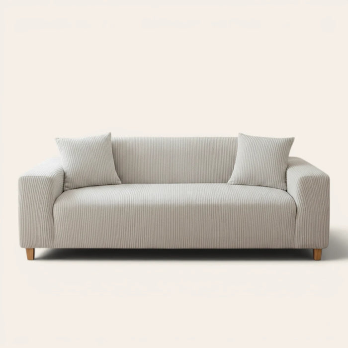 Silver Cloud corduroy sofa cover fitted on a three-seat sofa with matching cushions, front view on ivory