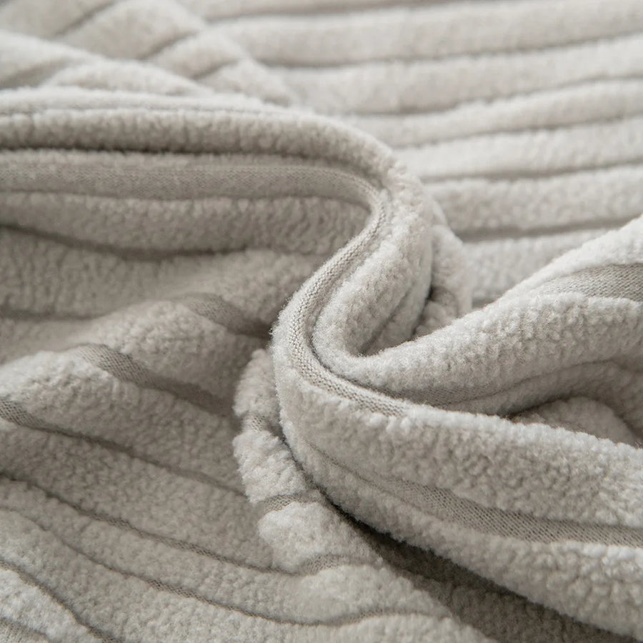 Macro of the Silver Cloud corduroy fabric with gentle folds revealing its plush ribbing