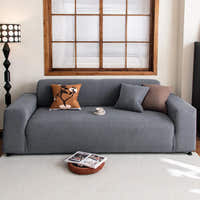 Steel Gray corduroy sofa cover in a living room with a wood-framed window and floor lamp