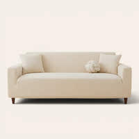 Warm beige corduroy sofa cover fitted on a three seater sofa, front view on ivory