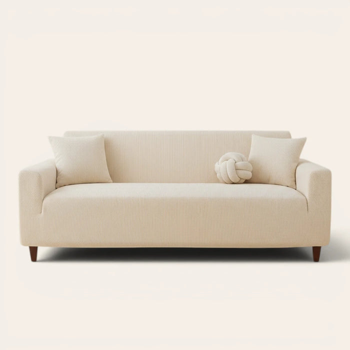 Warm beige corduroy sofa cover fitted on a three seater sofa, front view on ivory