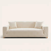 Cream Petal floral sofa cover fitted on a three-seat sofa with matching cushions, front view on ivory