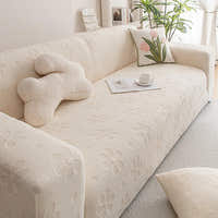 Cream Petal floral sofa cover in a soft living room with a tulip cushion and potted plant