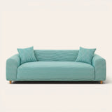 Aqua Mist ice silk sofa cover fitted on a three-seat sofa with matching cushions, front view on ivory