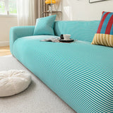 Close angled view of the Aqua Mist ice silk cover draping snugly over the seat and armrest