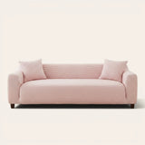 Blush Petal ice silk sofa cover fitted on a three-seat sofa with matching cushions, front view on ivory