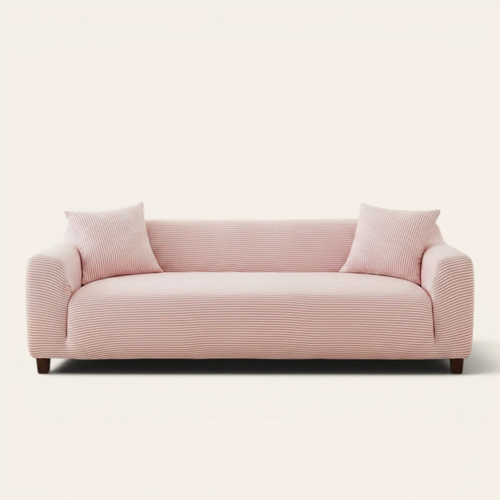 Blush Petal ice silk sofa cover fitted on a three-seat sofa with matching cushions, front view on ivory