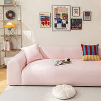 Blush Petal ice silk sofa cover in a bright living room with a gallery wall and coffee cup