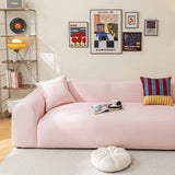 Blush Petal ice silk sofa cover in a bright living room with a gallery wall and coffee cup
