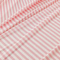 Macro close-up of the Blush Petal ice silk fabric showing its soft pink and white stripe