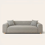 Midnight Tide ice silk sofa cover fitted on a three-seat sofa with matching cushions, front view on ivory