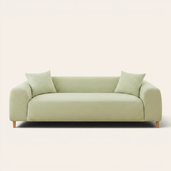 Mint Breeze ice silk sofa cover fitted on a three-seat sofa, front view on ivory background