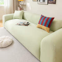 Mint Breeze ice silk sofa cover styled in a living room with a striped accent cushion