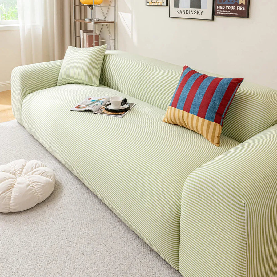 Mint Breeze ice silk sofa cover styled in a living room with a striped accent cushion