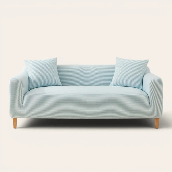 Light blue striped ice silk sofa cover on a three-seater, front view on ivory backdrop with matching cushions