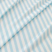 Macro of the ice silk weave with fine light blue and white stripes, showing its smooth cool sheen
