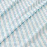 Macro of the ice silk weave with fine light blue and white stripes, showing its smooth cool sheen