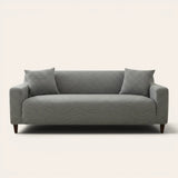Mist grey jacquard sofa cover on a three-seater, front view on ivory backdrop with two matching cushions