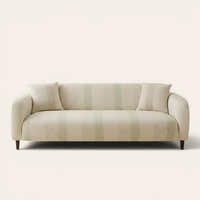 Cream jacquard sofa cover with soft sage stripes on a three-seater, front view on ivory backdrop with matching cushions
