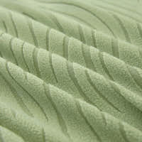 Macro of the sage green jacquard weave, showing its soft raised wavy stripes