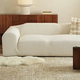 Sand linen jacquard sofa cover styled in a bright living room with a wood sideboard and sheepskin rug