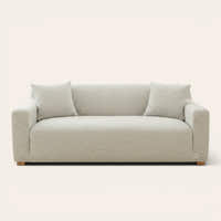Soft ivory jacquard sofa cover fitted on a three-seater with wave pattern, front view on ivory backdrop