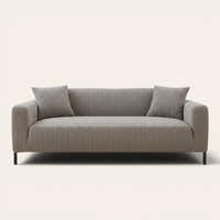 Charcoal ribbed knit sofa cover fitted on a three-seat couch with cushions, front view on ivory.