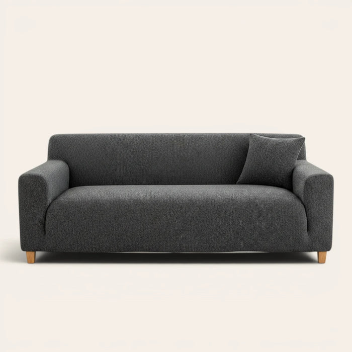 Charcoal knit sofa cover fitted on a three-seater, front view on ivory backdrop