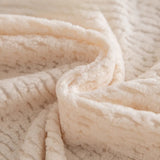 Macro of plush cream beige knit fabric showing fleece texture and fine striping