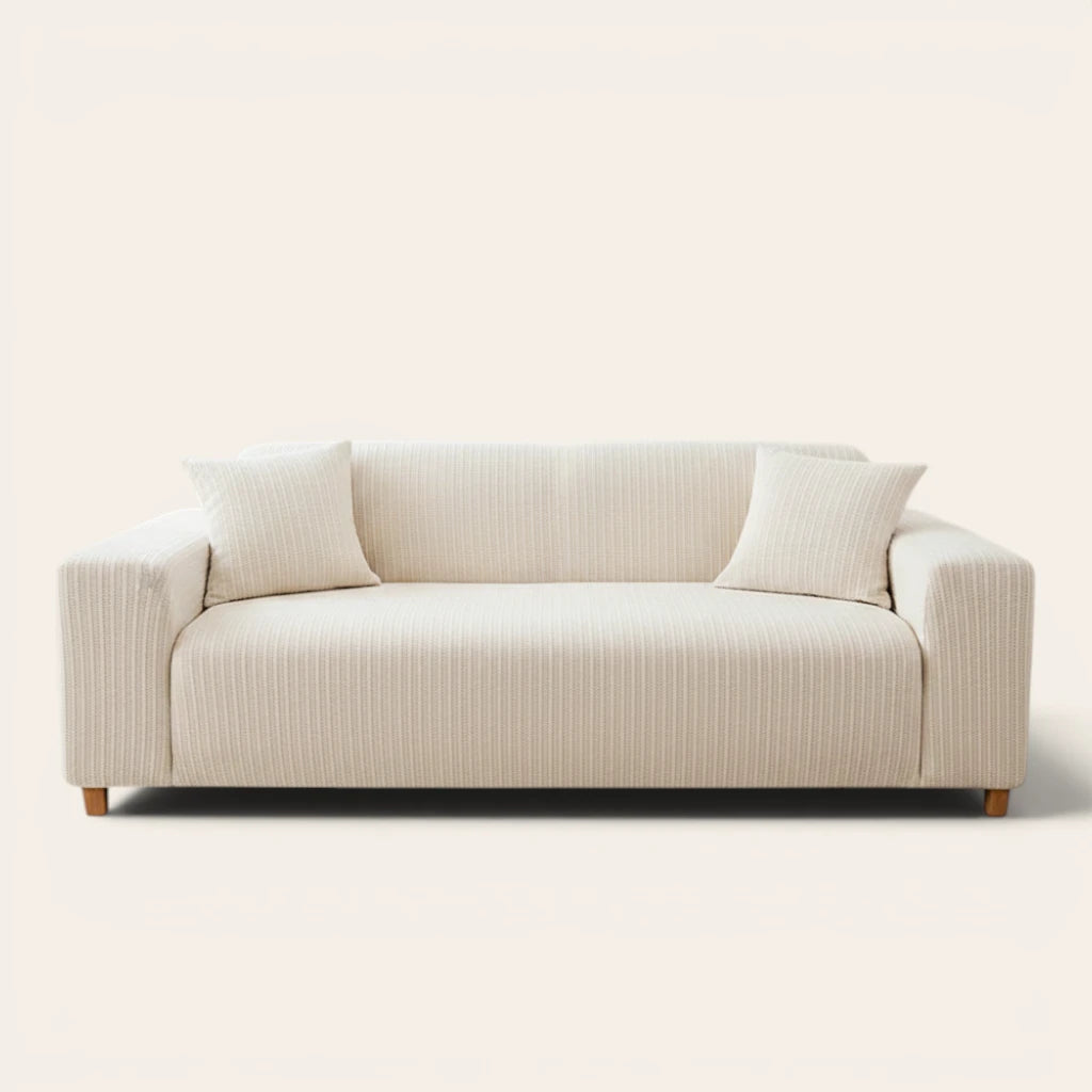 Cream ivory knit sofa cover fitted on a three-seater with vertical striping, front view on ivory backdrop