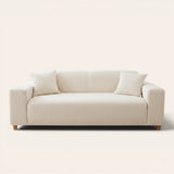Cream ivory knit sofa cover fitted on a three-seater with vertical striping, front view on ivory backdrop