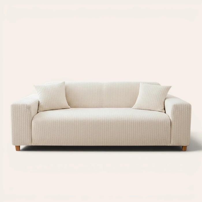 Cream ivory knit sofa cover fitted on a three-seater with vertical striping, front view on ivory backdrop