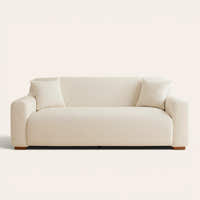 Cream linen knit sofa cover fitted on a three-seater, front view on ivory backdrop