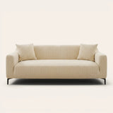 Honey taupe knit sofa cover fitted on a three-seater with vertical ribbing, front view on ivory backdrop