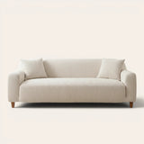 Ivory sand knit sofa cover fitted on a three-seater, front view on ivory backdrop